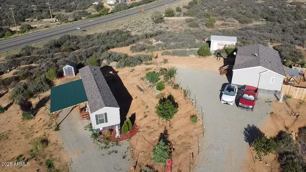 an aerial view of houses with yard