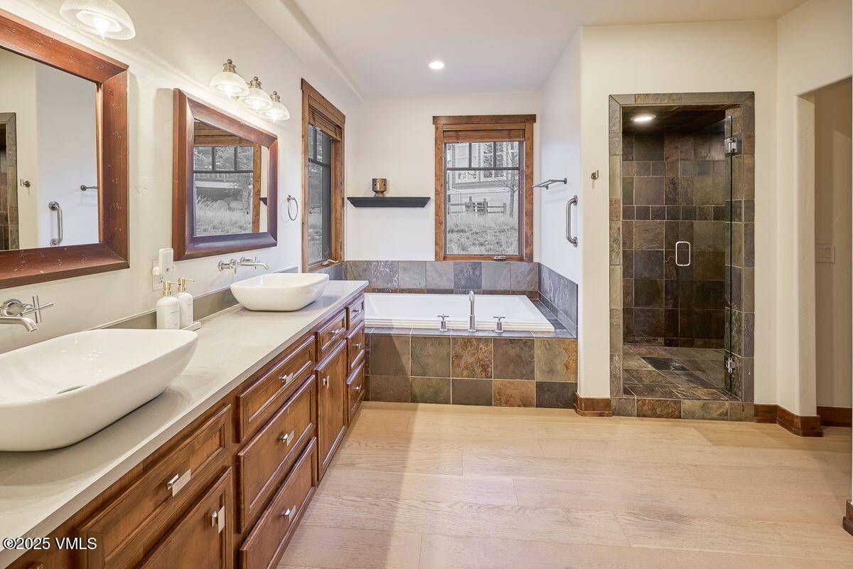 748 Hernage Creek Road Eagle, CO 81631 - Photo 15 of 44 a spacious bathroom with a tub sink and mirror