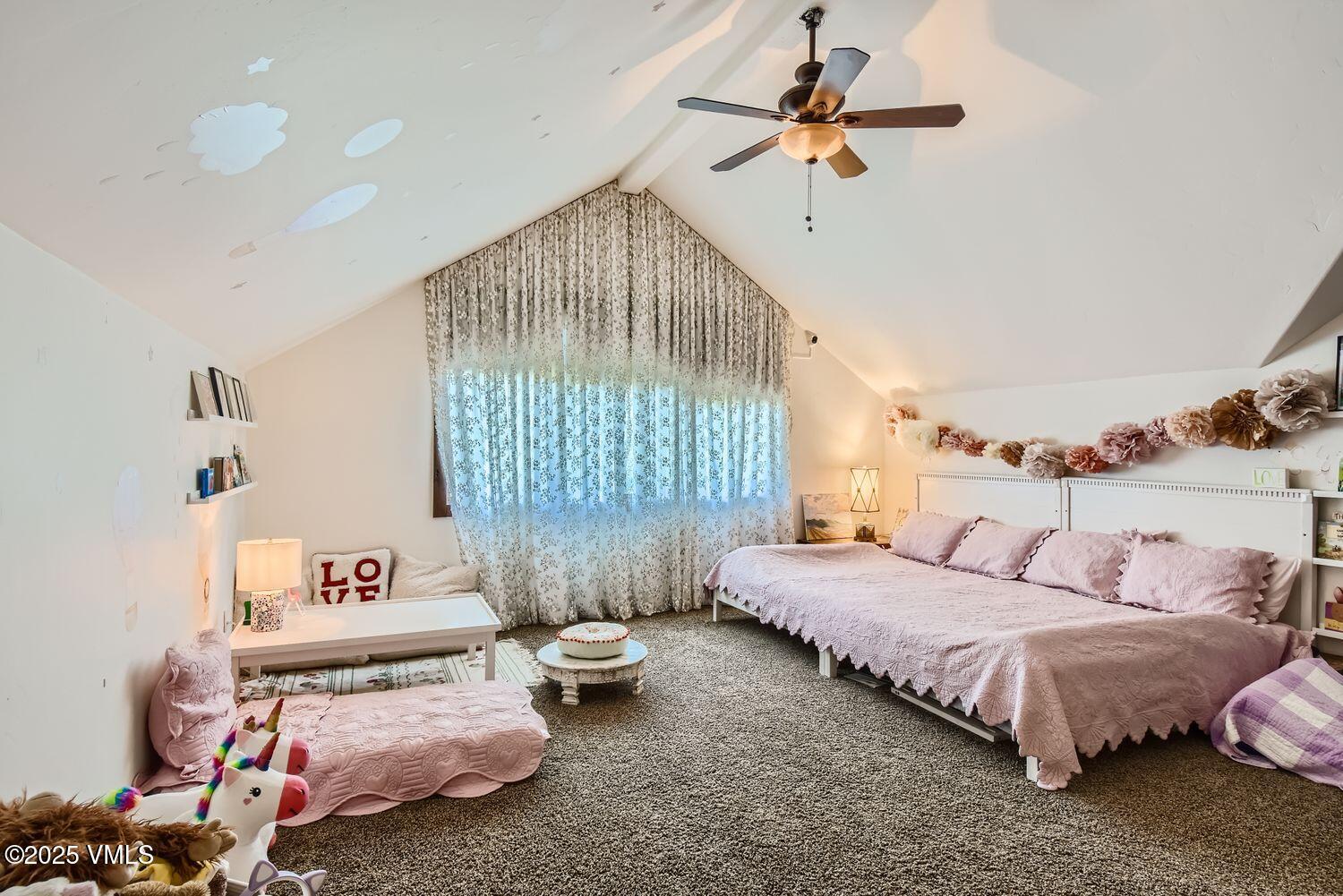 748 Hernage Creek Road Eagle, CO 81631 - Photo 19 of 44 a bedroom with bed and a chandelier