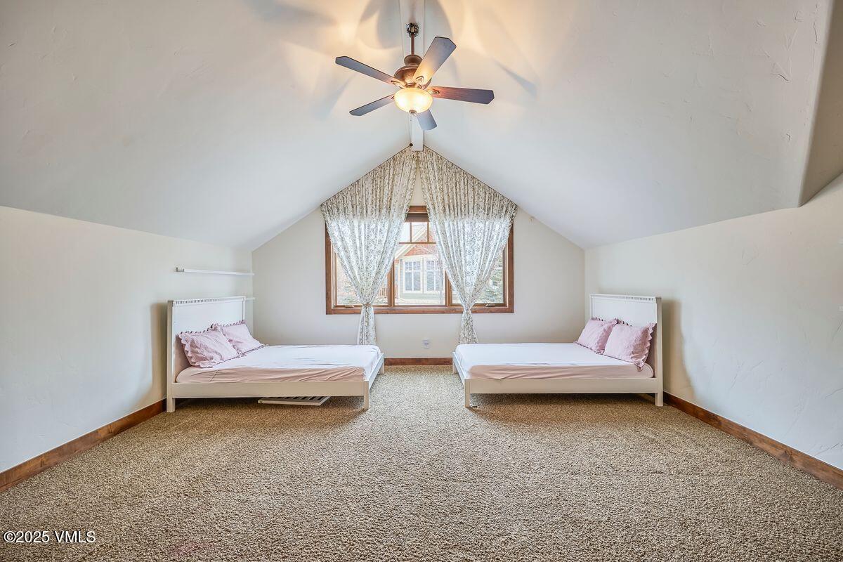 748 Hernage Creek Road Eagle, CO 81631 - Photo 20 of 44 a bedroom with furniture and window
