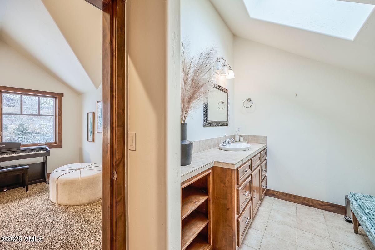 748 Hernage Creek Road Eagle, CO 81631 - Photo 21 of 44 a bathroom with a sink a mirror and a toilet
