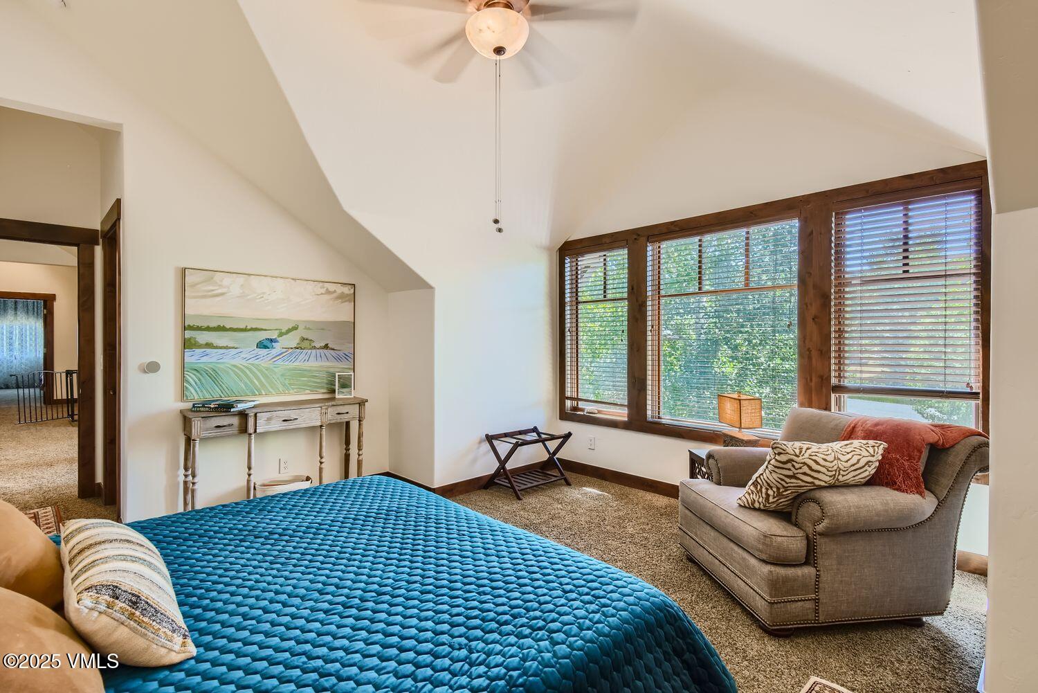 748 Hernage Creek Road Eagle, CO 81631 - Photo 22 of 44 a bedroom with furniture and a large window