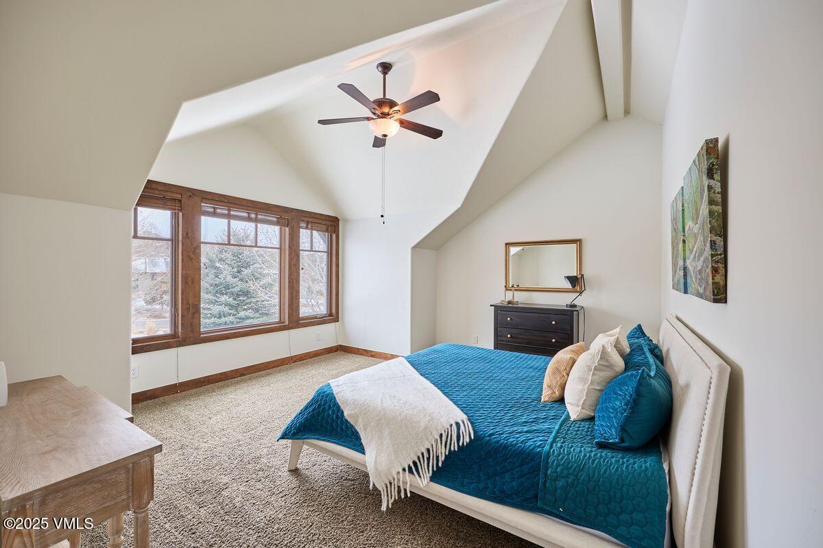 748 Hernage Creek Road Eagle, CO 81631 - Photo 23 of 44 a bedroom with furniture and a large window
