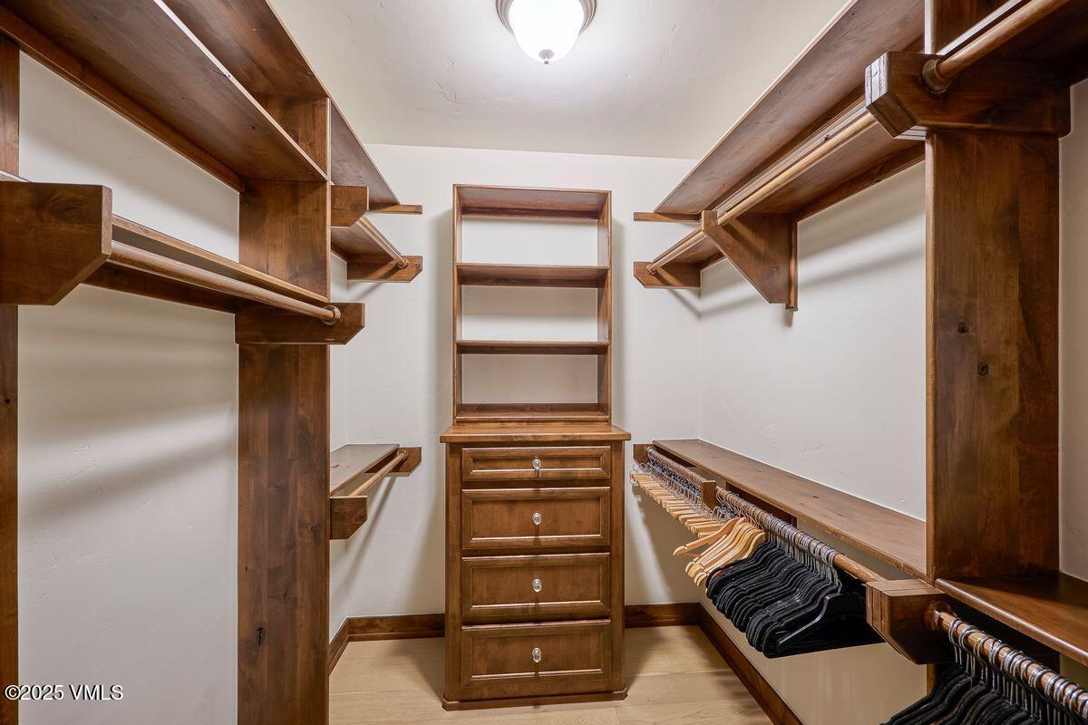 748 Hernage Creek Road Eagle, CO 81631 - Photo 26 of 44 a view of walk in closet with clothes