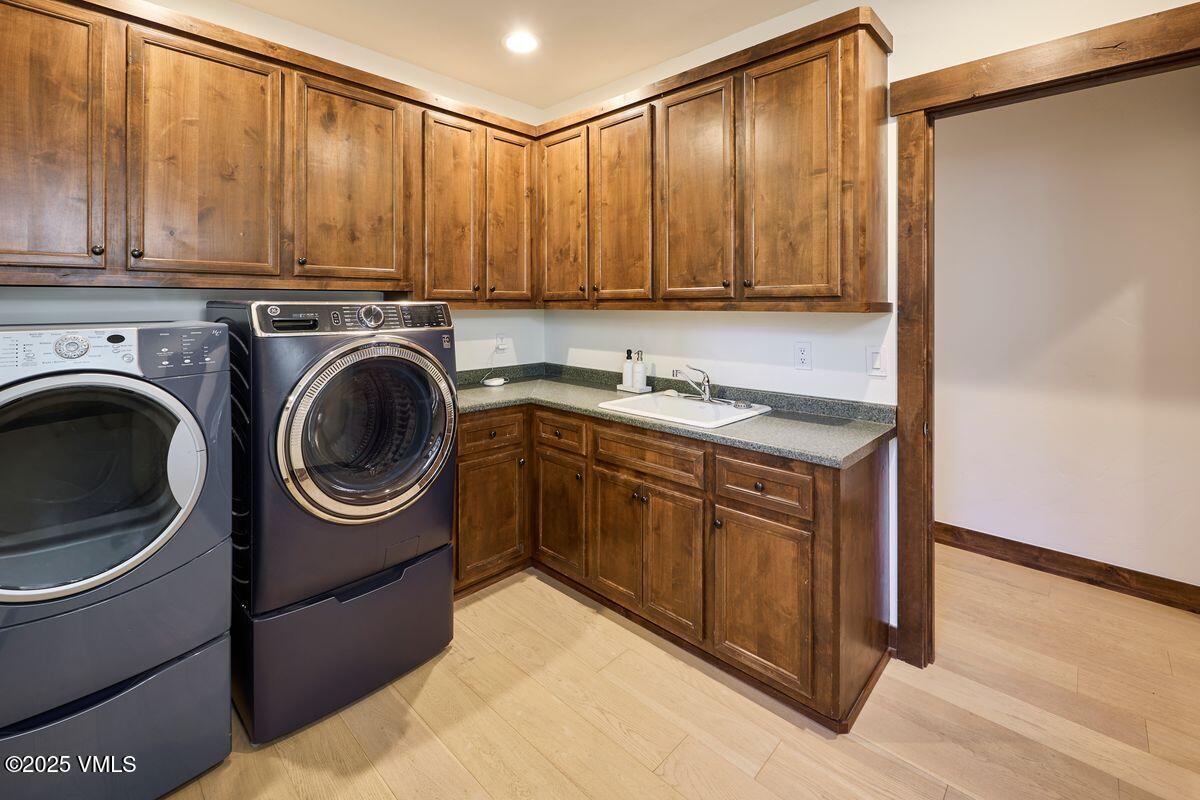 748 Hernage Creek Road Eagle, CO 81631 - Photo 28 of 44 a utility room with sink dryer and washer
