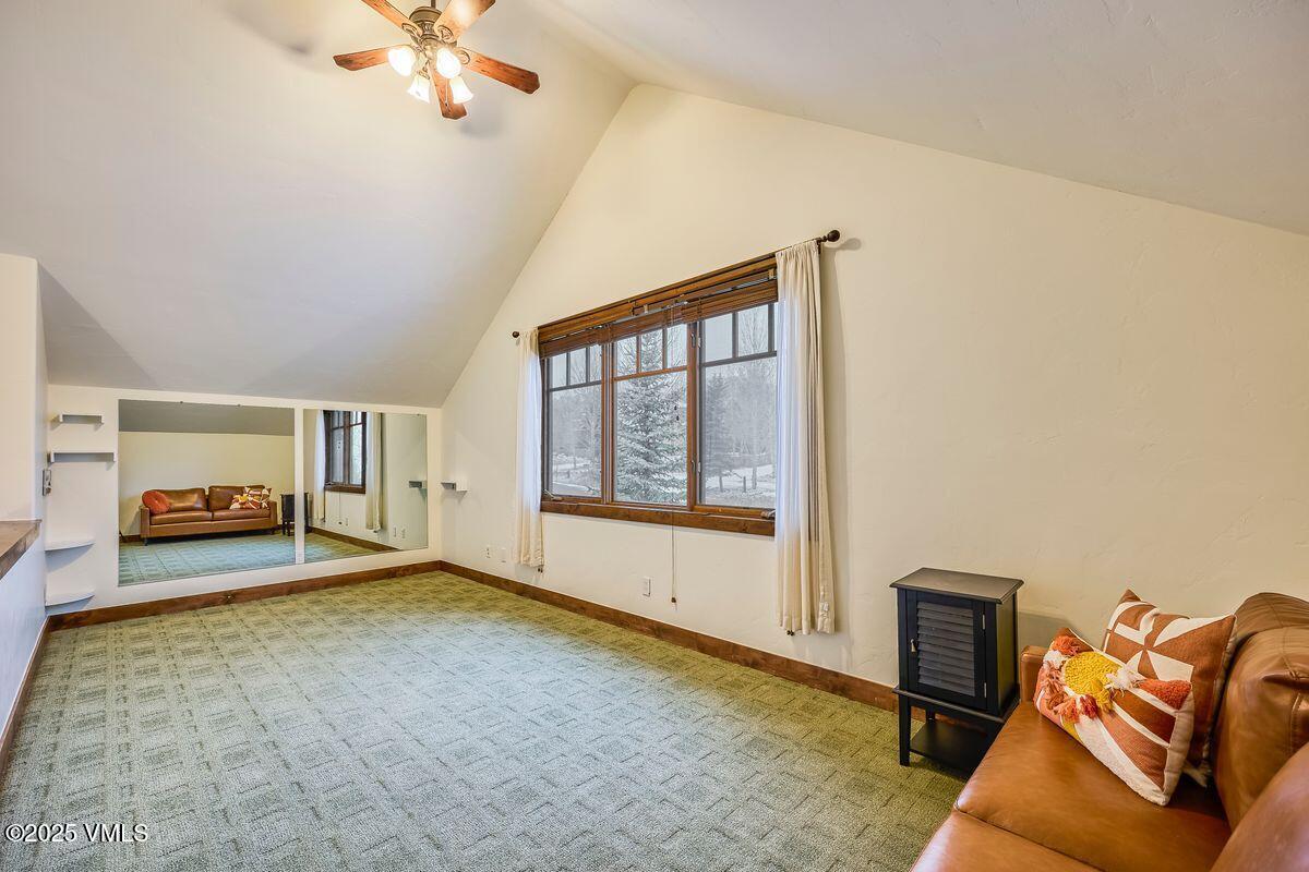 748 Hernage Creek Road Eagle, CO 81631 - Photo 30 of 44 a living room with furniture and a chandelier