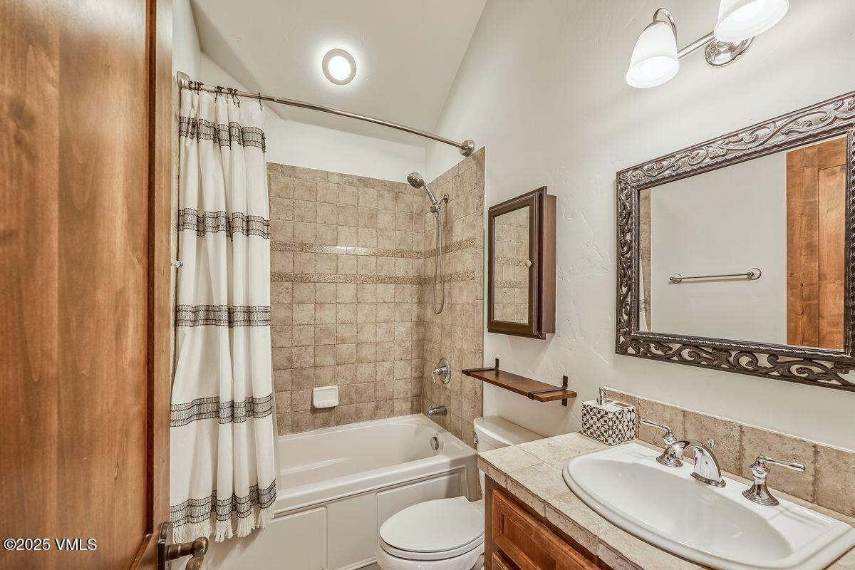 748 Hernage Creek Road Eagle, CO 81631 - Photo 33 of 44 a bathroom with a bathtub shower sink vanity and toilet