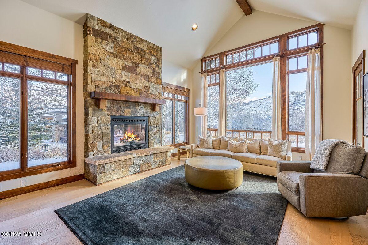 748 Hernage Creek Road Eagle, CO 81631 - Photo 5 of 44 a living room with furniture and a fireplace