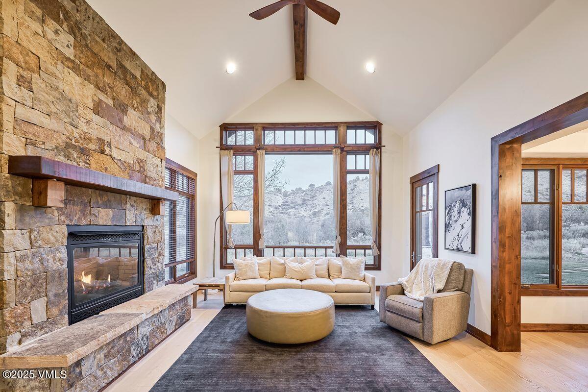 748 Hernage Creek Road Eagle, CO 81631 - Photo 6 of 44 a living room with furniture and a fireplace