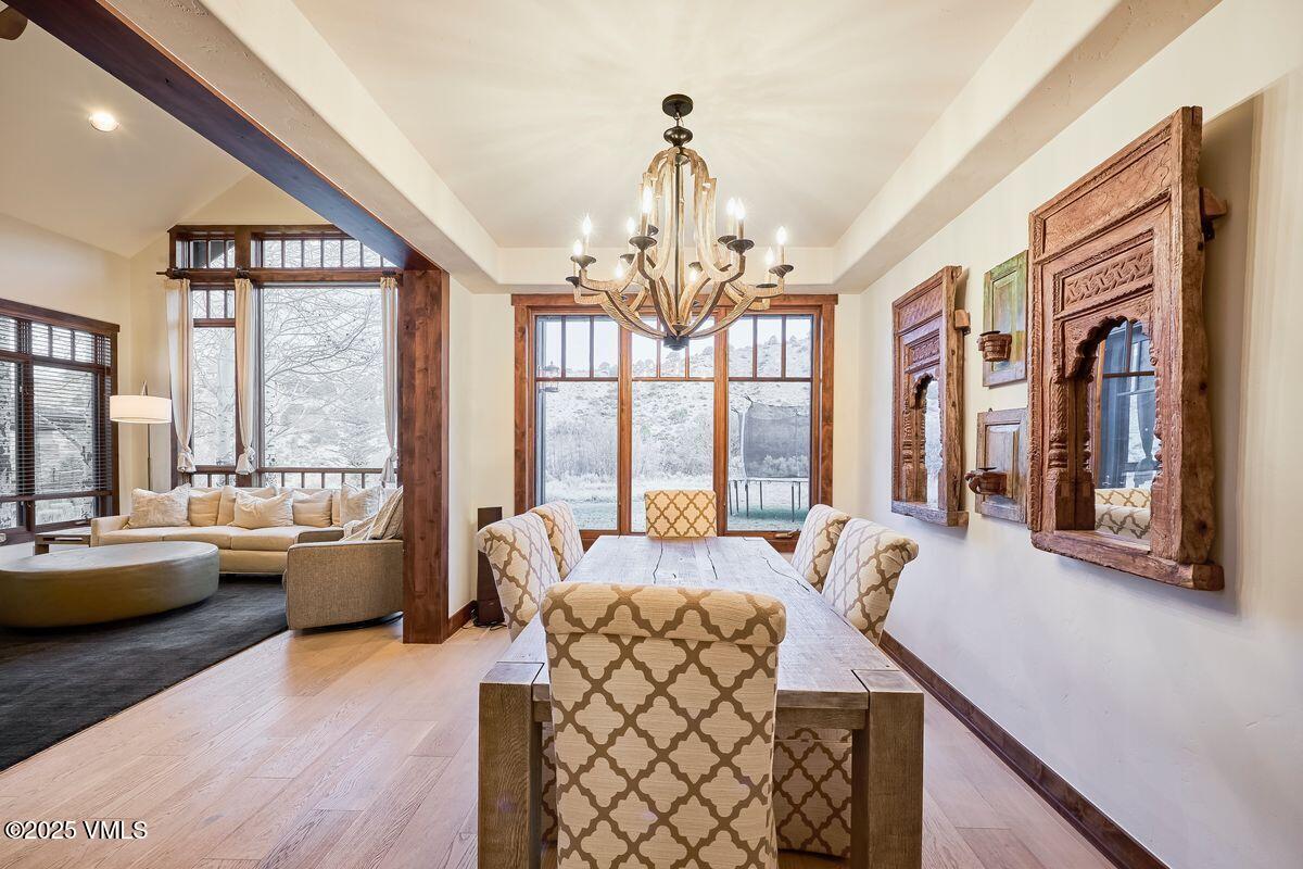 748 Hernage Creek Road Eagle, CO 81631 - Photo 9 of 44 a very nice looking living room with a large window and a chandelier
