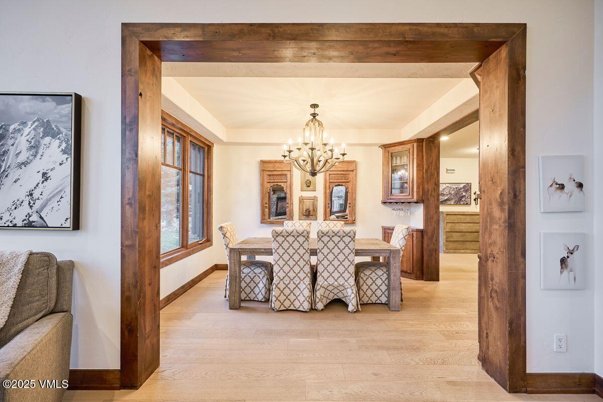 748 Hernage Creek Road Eagle, CO 81631 - Photo 10 of 44 a living room with furniture and a chandelier