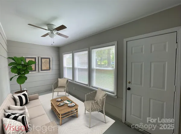 a living room with furniture and a window