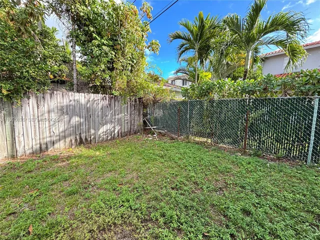 a garden with palm trees