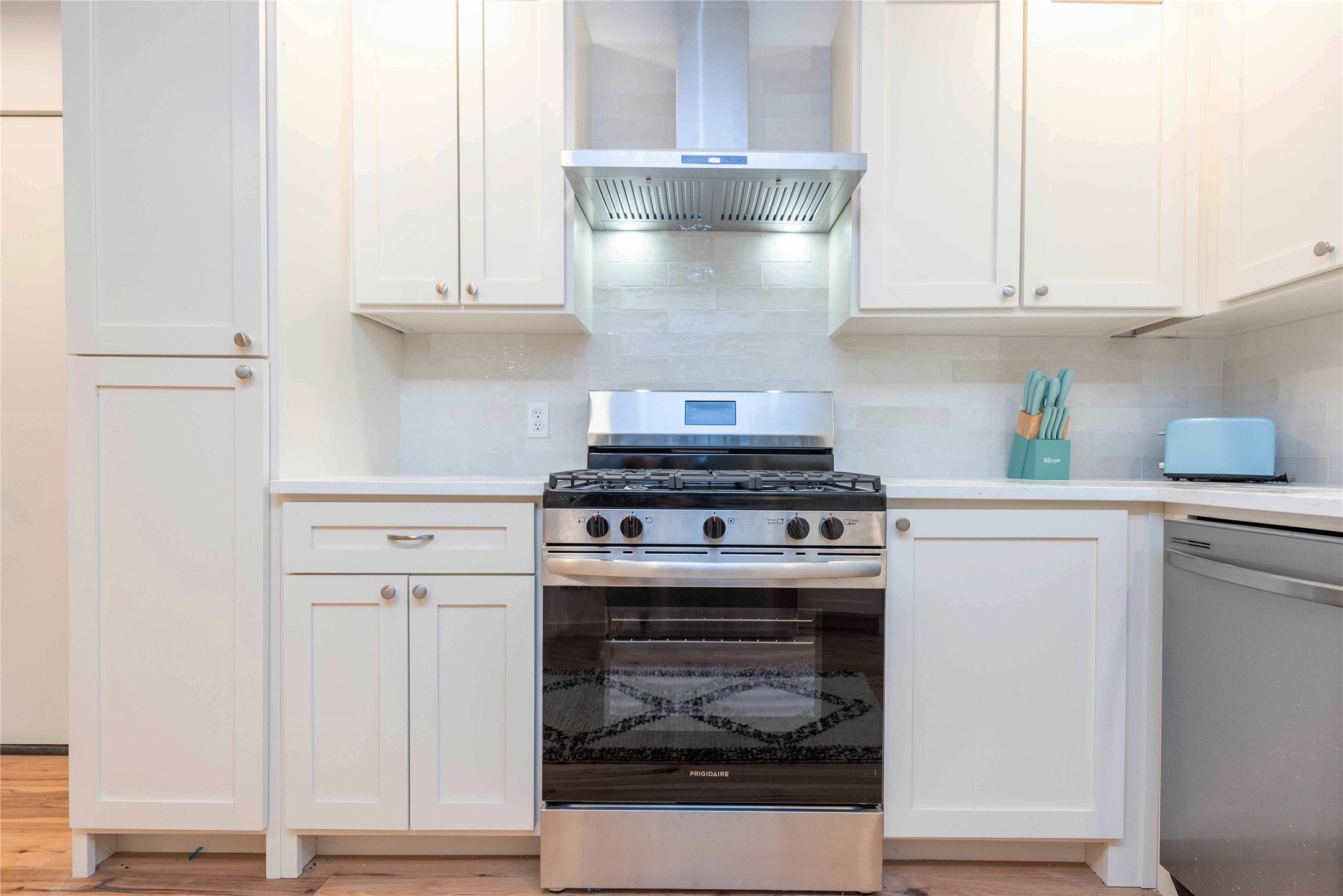 3801 Wilson Street Austin, TX 78704 - Photo 12 of 36 a stove top oven sitting inside of a kitchen