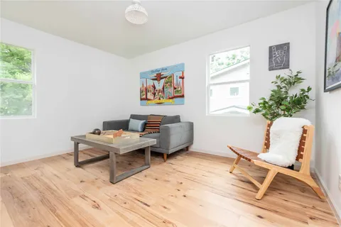 a workspace with furniture window and wooden floor