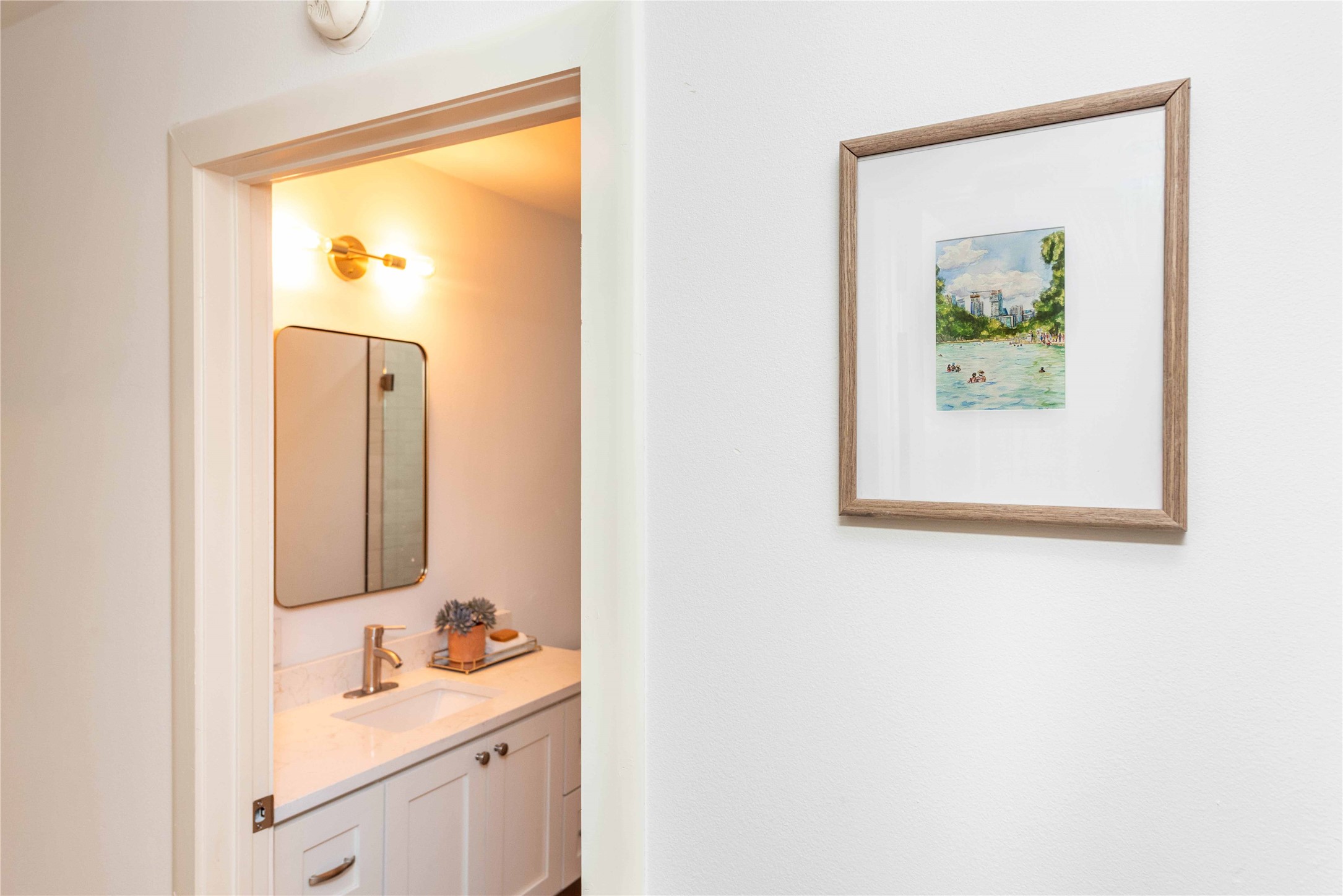 3801 Wilson Street Austin, TX 78704 - Photo 33 of 36 a bathroom with a sink and a mirror