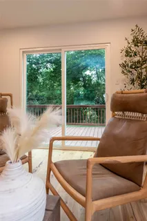 a living room with a couch and a large window