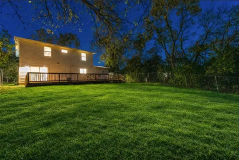a view of a back yard of the house