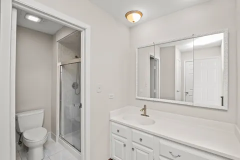 a bathroom with a shower and toilet