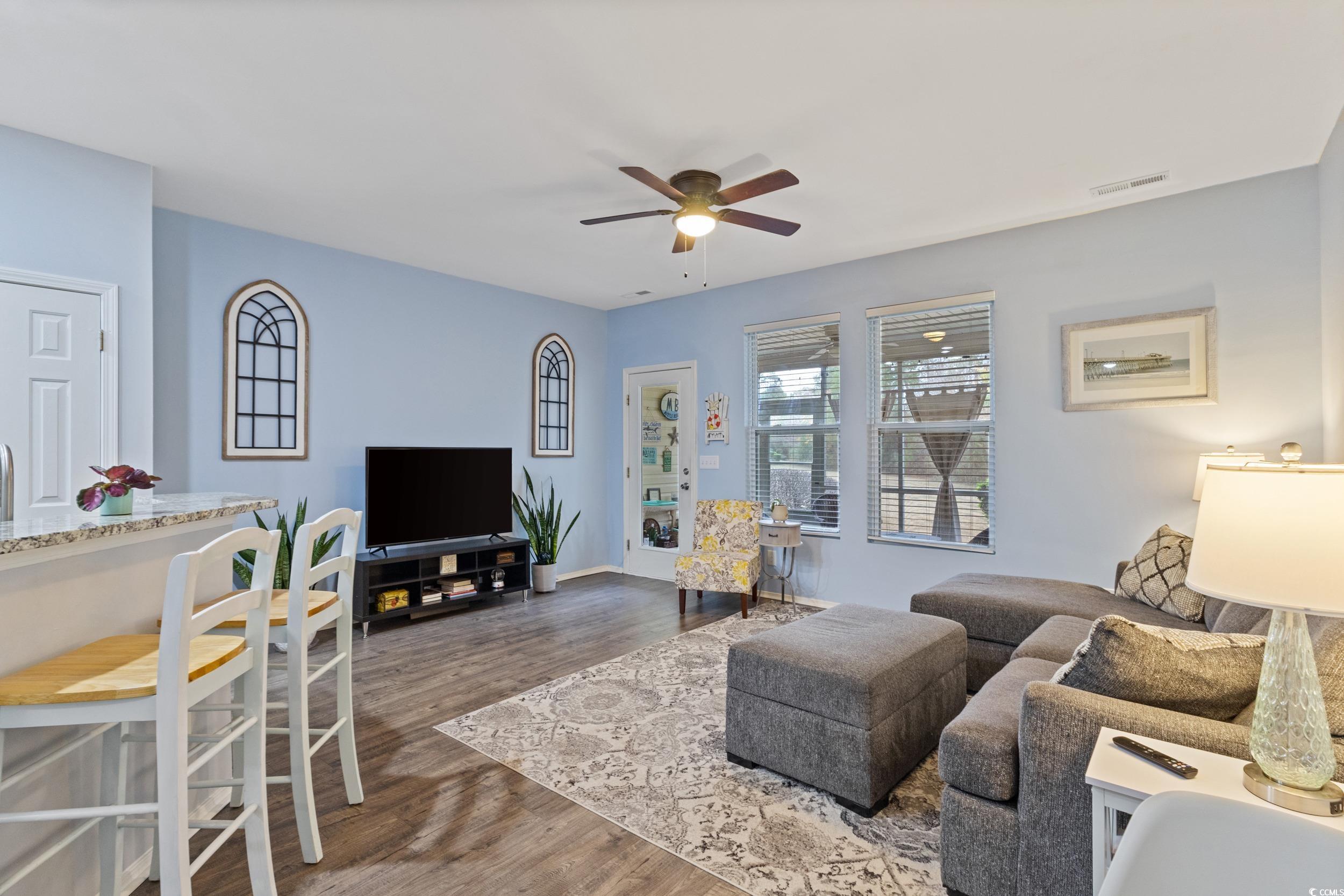 140 Olde Towne Way, Unit 2 Myrtle Beach, SC 29588 - Photo 17 of 40 Living room with dark wood-style flooring and a ceiling fan