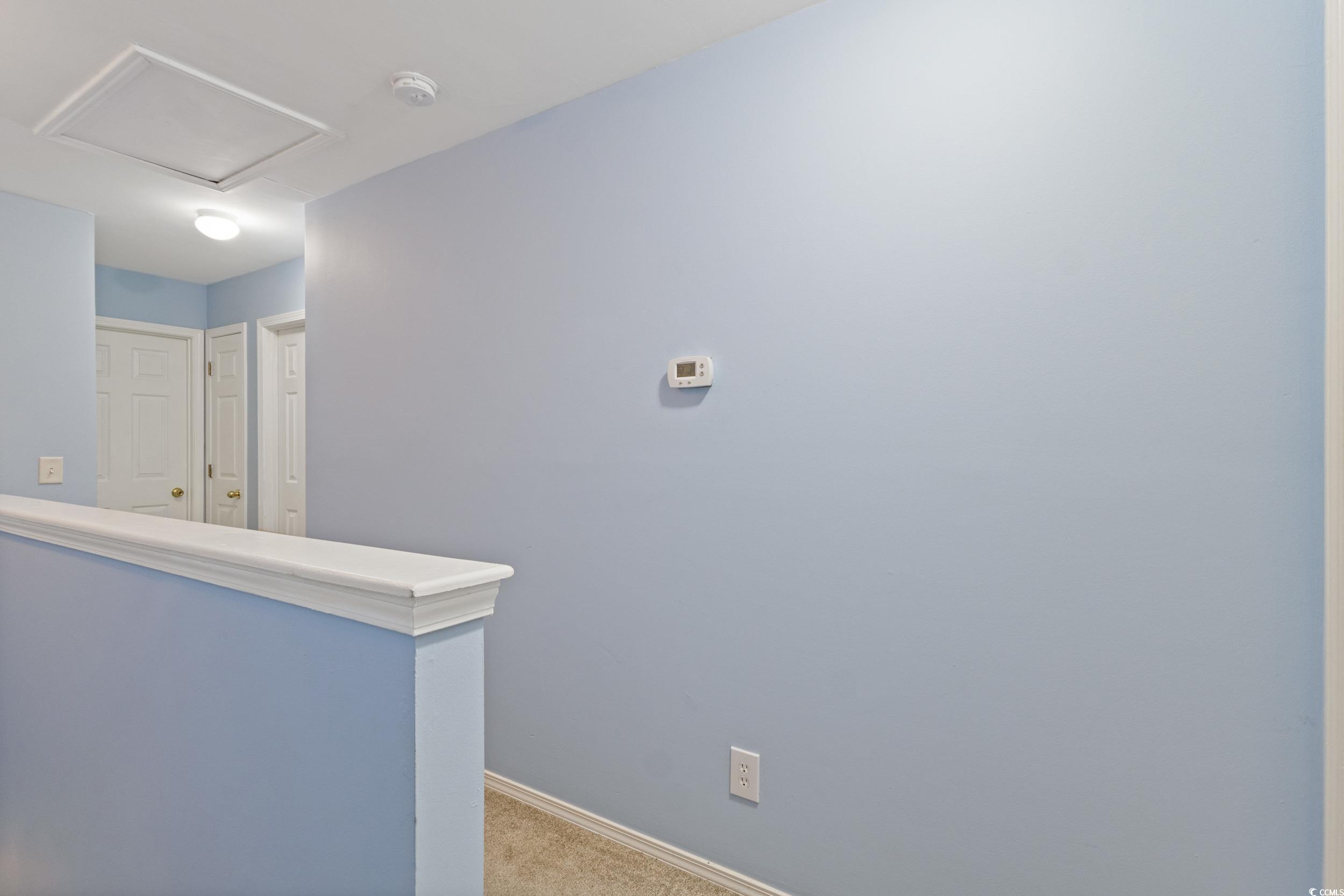 140 Olde Towne Way, Unit 2 Myrtle Beach, SC 29588 - Photo 21 of 40 Hall with carpet floors and attic access