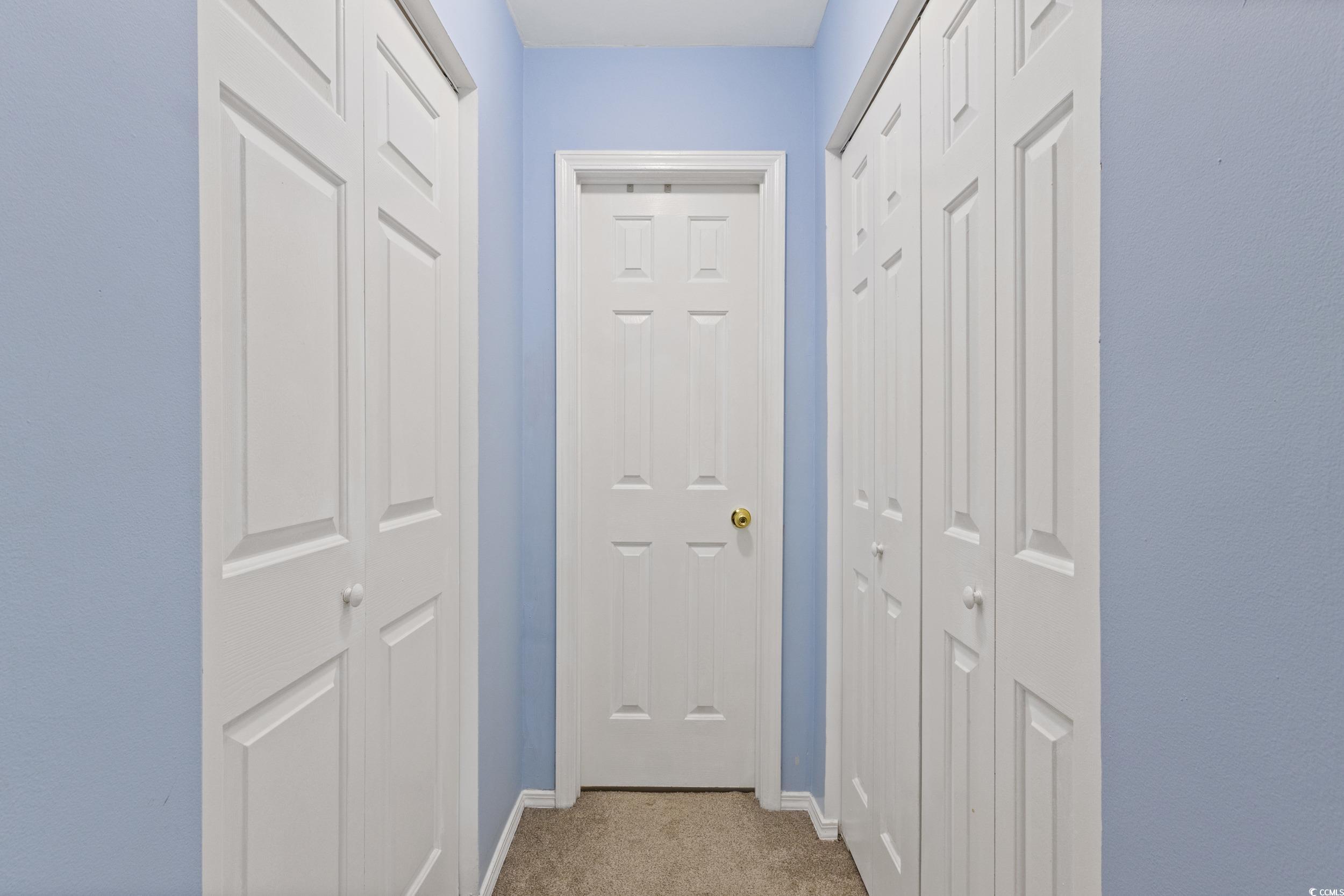 140 Olde Towne Way, Unit 2 Myrtle Beach, SC 29588 - Photo 22 of 40 Hall with carpet floors and baseboards