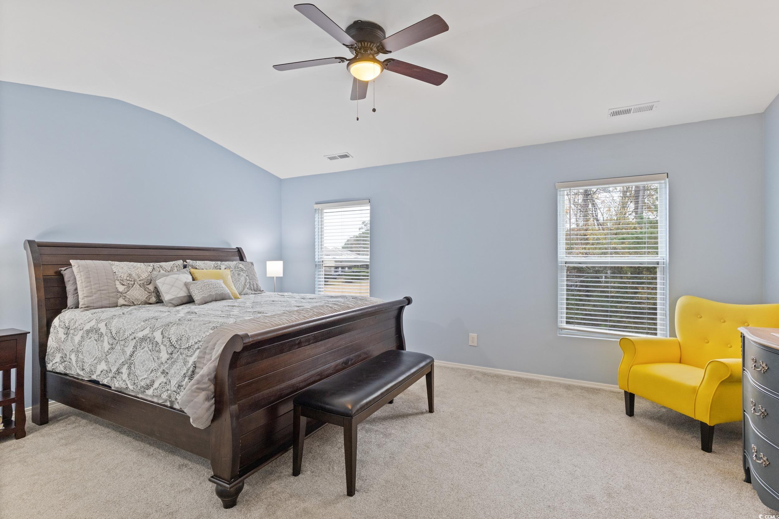 140 Olde Towne Way, Unit 2 Myrtle Beach, SC 29588 - Photo 23 of 40 Bedroom with light colored carpet, lofted ceiling, and a ceiling fan