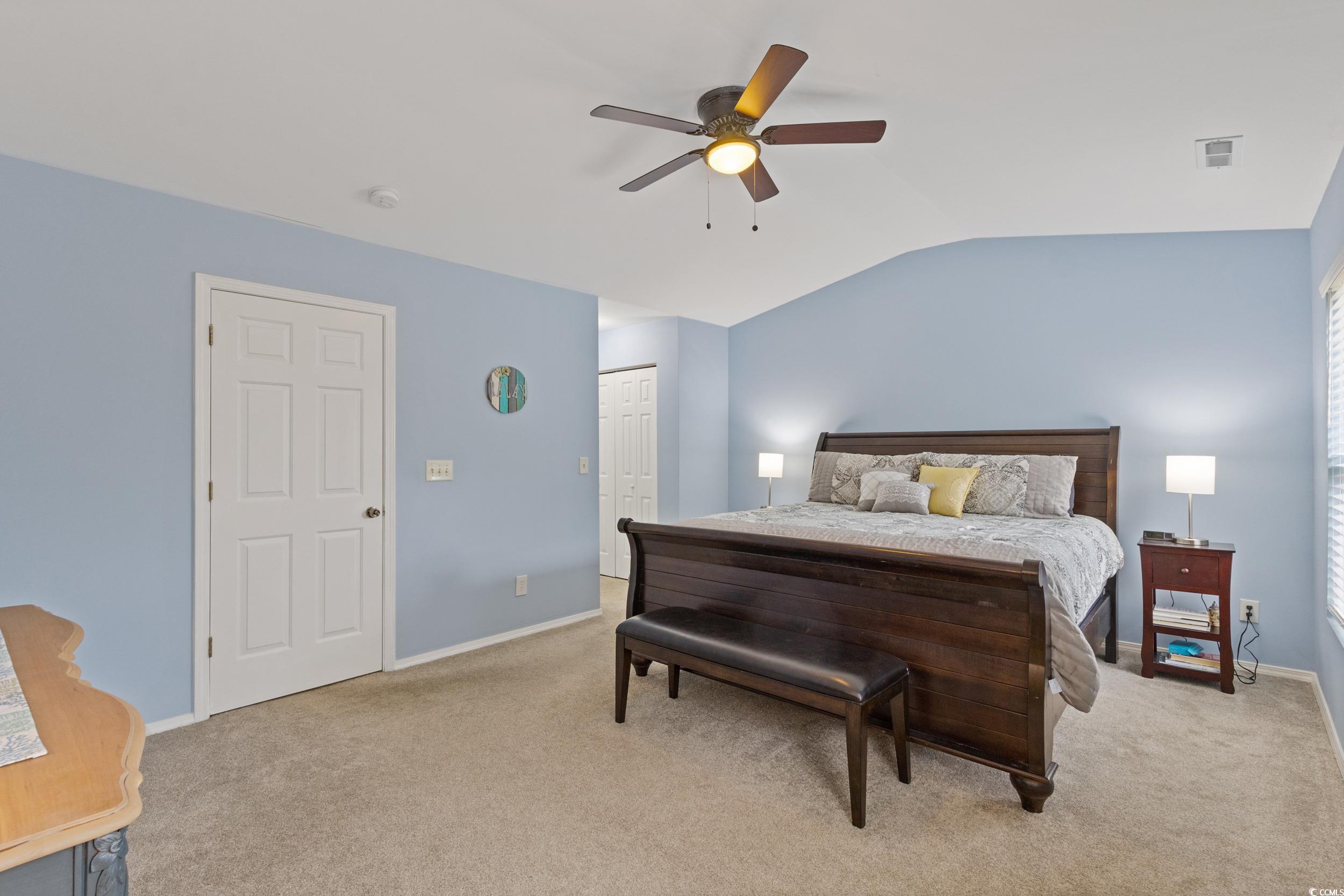 140 Olde Towne Way, Unit 2 Myrtle Beach, SC 29588 - Photo 24 of 40 Bedroom with a closet, lofted ceiling, light carpet, and a ceiling fan