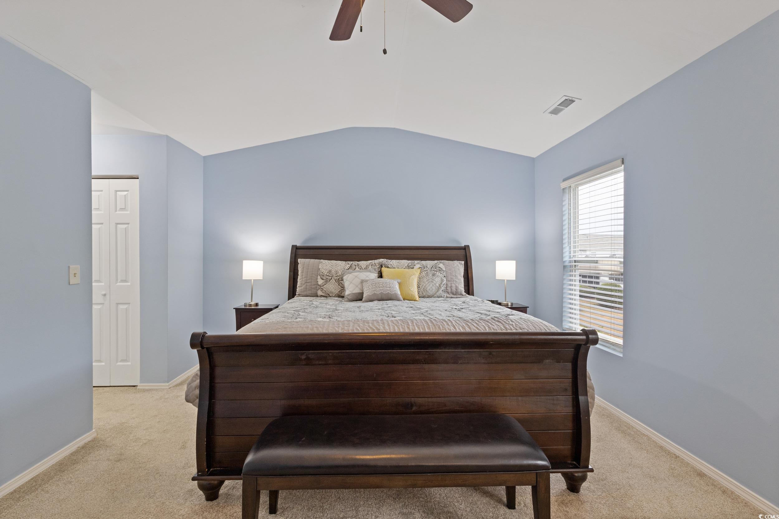 140 Olde Towne Way, Unit 2 Myrtle Beach, SC 29588 - Photo 25 of 40 Bedroom featuring lofted ceiling, light colored carpet, ceiling fan, and a closet