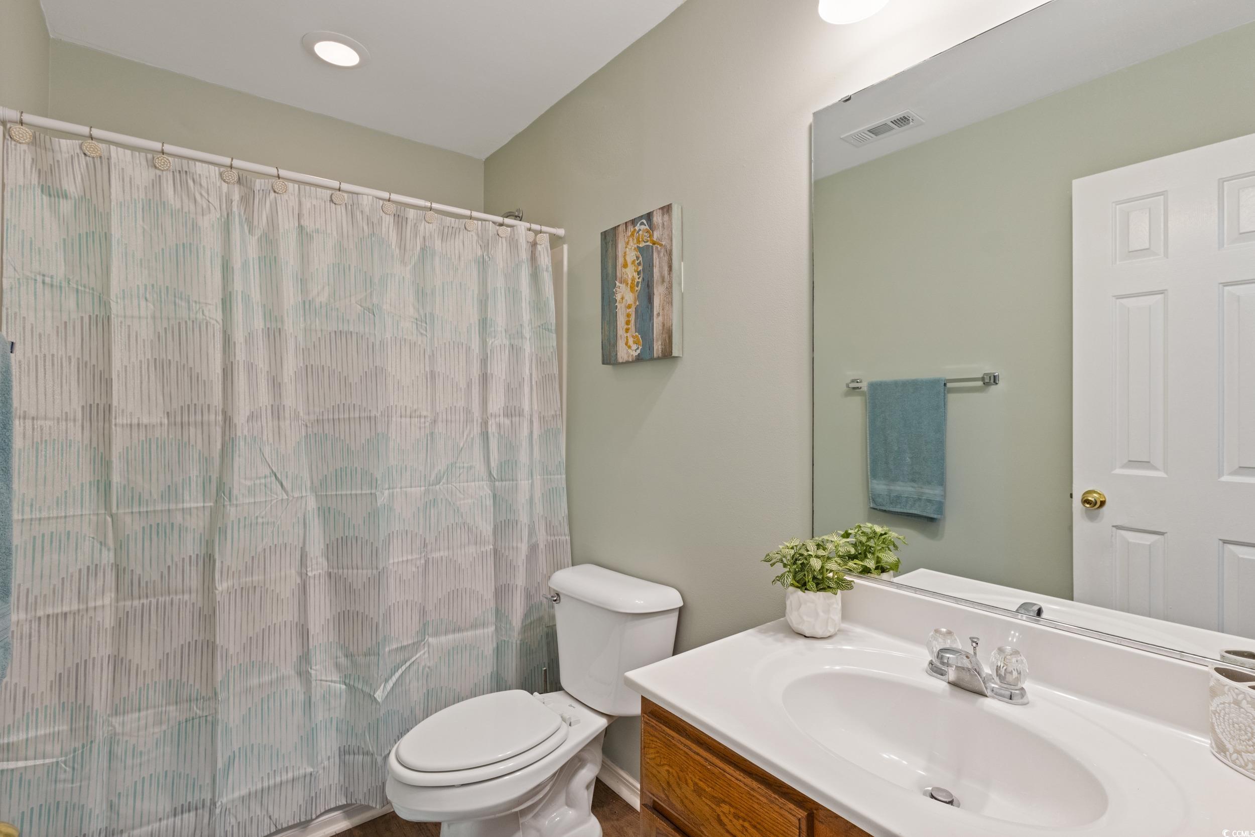 140 Olde Towne Way, Unit 2 Myrtle Beach, SC 29588 - Photo 29 of 40 Full bathroom featuring vanity and curtained shower