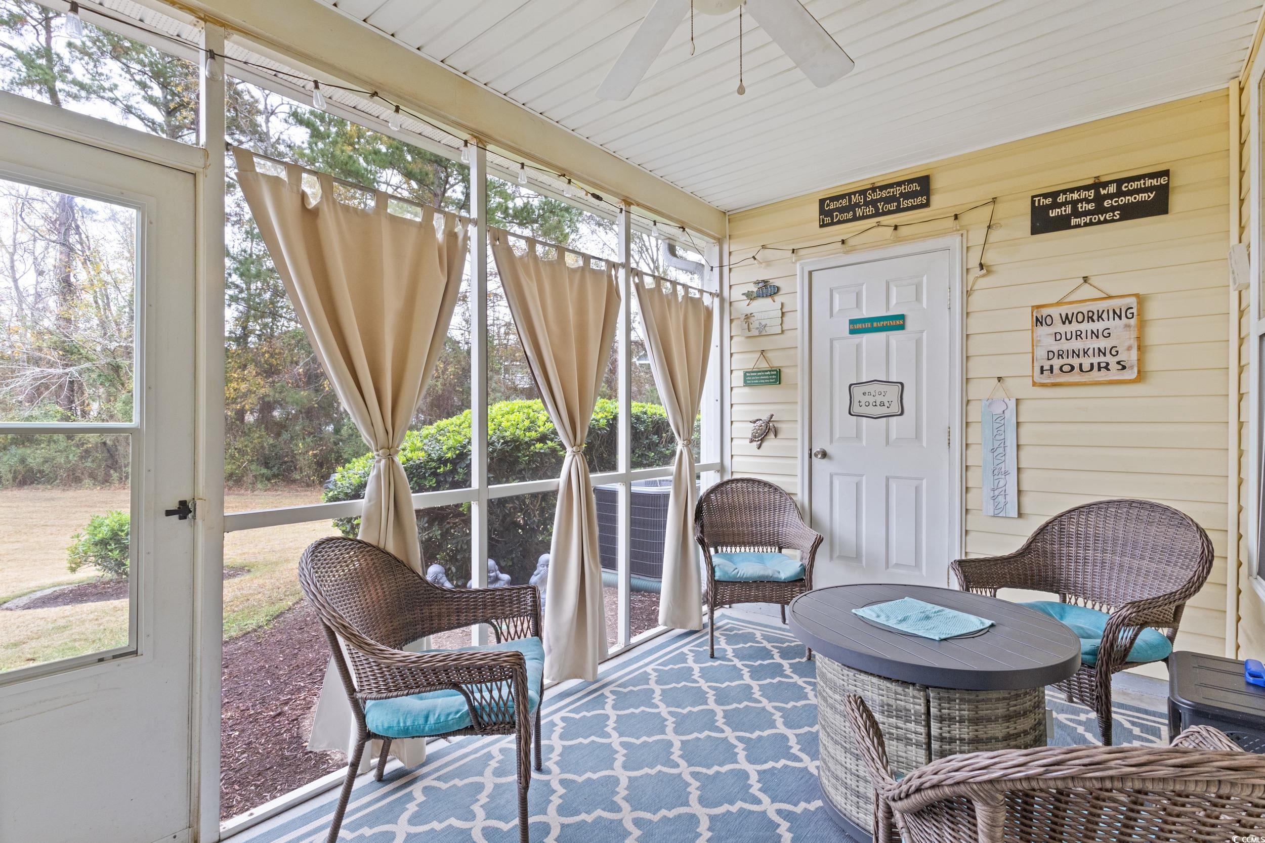 140 Olde Towne Way, Unit 2 Myrtle Beach, SC 29588 - Photo 34 of 40 Sunroom featuring a ceiling fan