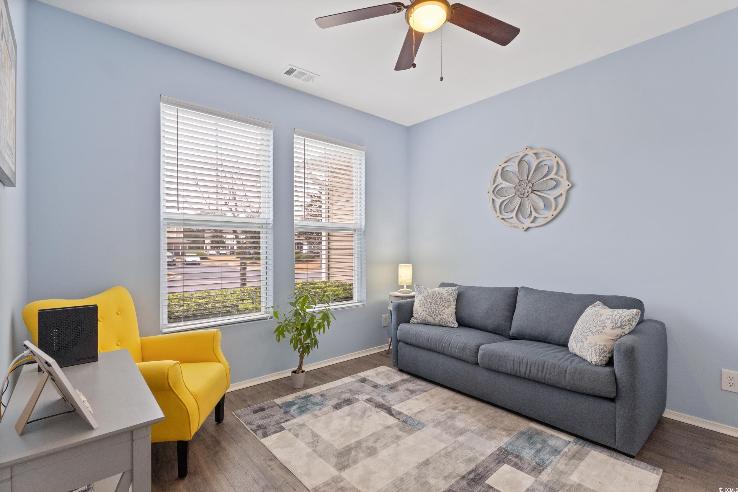 140 Olde Towne Way, Unit 2 Myrtle Beach, SC 29588 - Photo 7 of 40 First floor bedroom with ceiling fan and wood finished floors