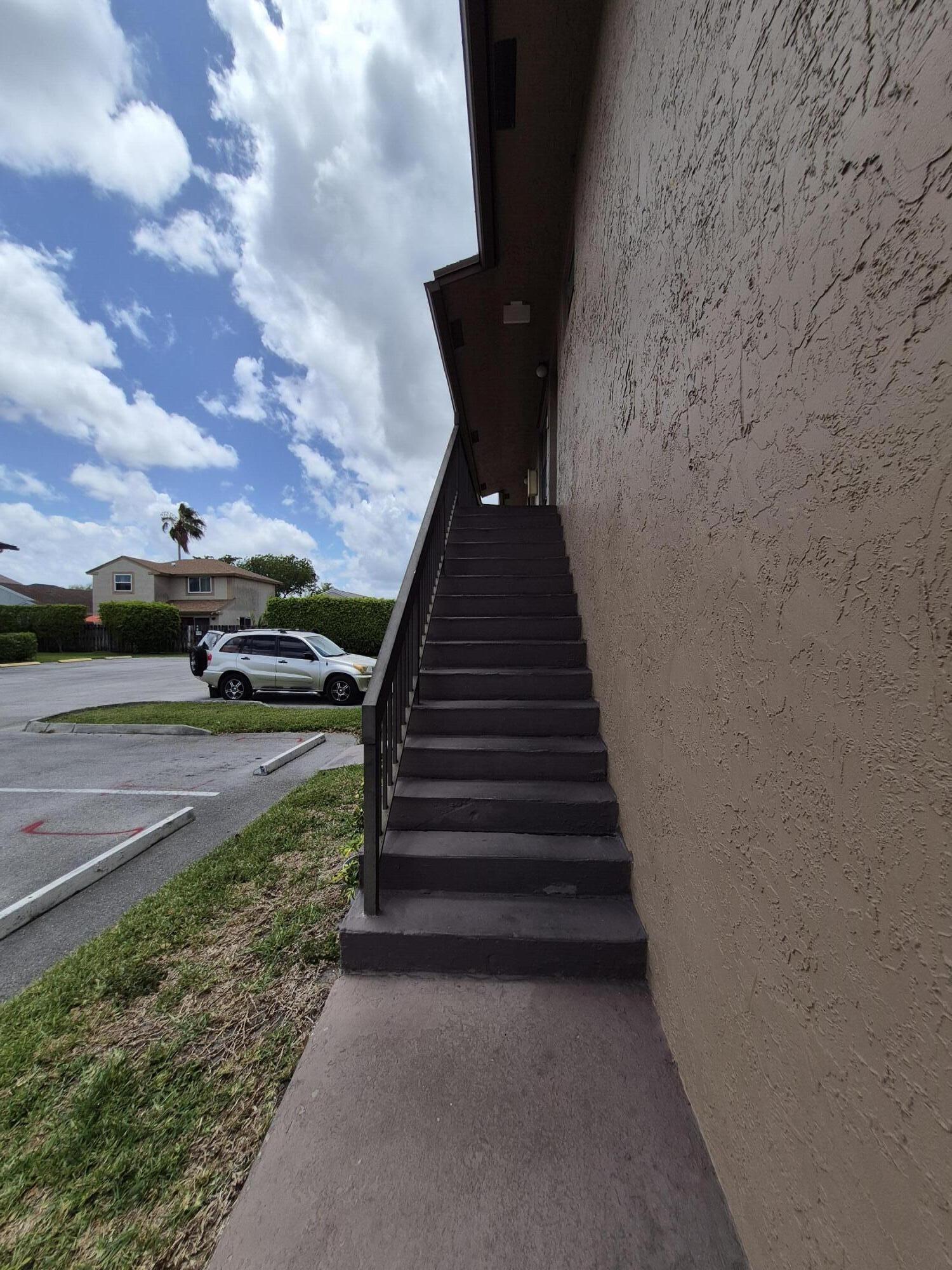 10039 Winding Lake Road, Unit 202 Sunrise, FL 33351 - Photo 4 of 14 a view of a yard with pathway