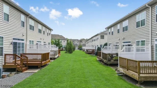a view of house with a deck yard
