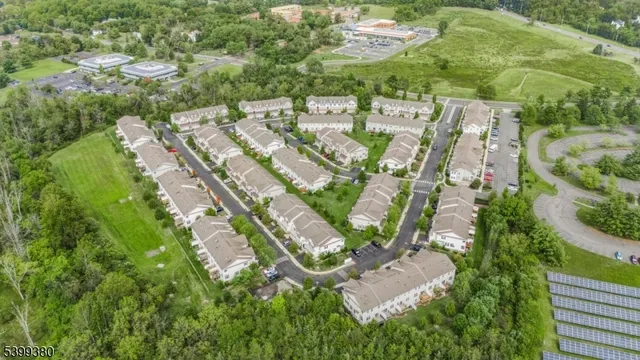 an aerial view of residential house with outdoor space and swimming pool