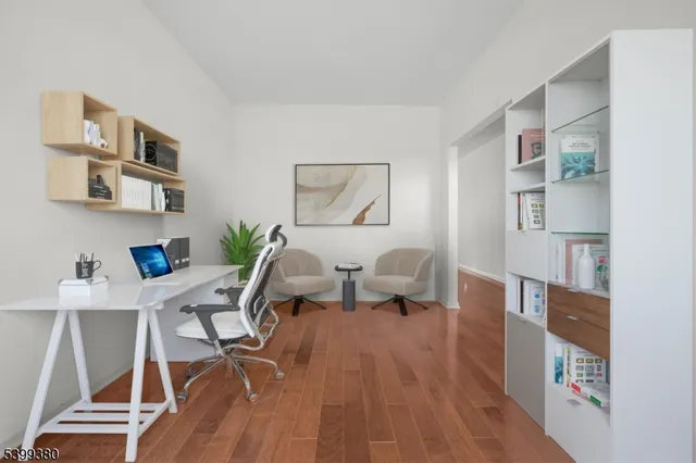 a work room with furniture and wooden floor