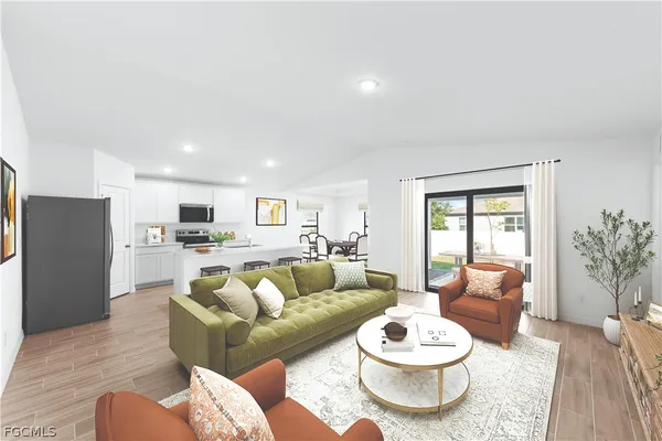 a living room with furniture and a potted plant