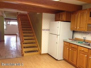 76 Pine Hollow Road Pownal, VT 05261 - Photo 12 of 17 a view of a kitchen with cabinets and stainless steel appliances
