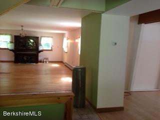 76 Pine Hollow Road Pownal, VT 05261 - Photo 5 of 17 a view of kitchen and empty room with wooden floor