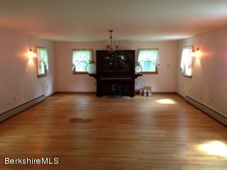 76 Pine Hollow Road Pownal, VT 05261 - Photo 8 of 17 a living room with hard wood floors and a window