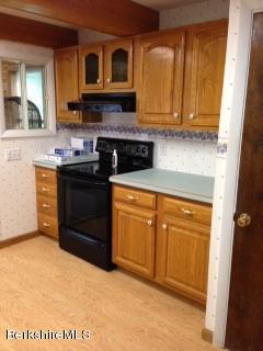 76 Pine Hollow Road Pownal, VT 05261 - Photo 10 of 17 a kitchen with stainless steel appliances granite countertop a stove and a sink