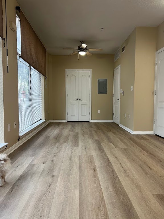 2505 San Gabriel Street, Unit 101 Austin, TX 78705 - Photo 2 of 9 an empty room with wooden floor and windows