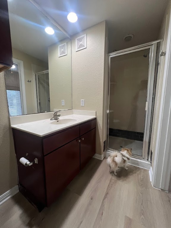 2505 San Gabriel Street, Unit 101 Austin, TX 78705 - Photo 7 of 9 a bathroom with a double vanity sink and mirror