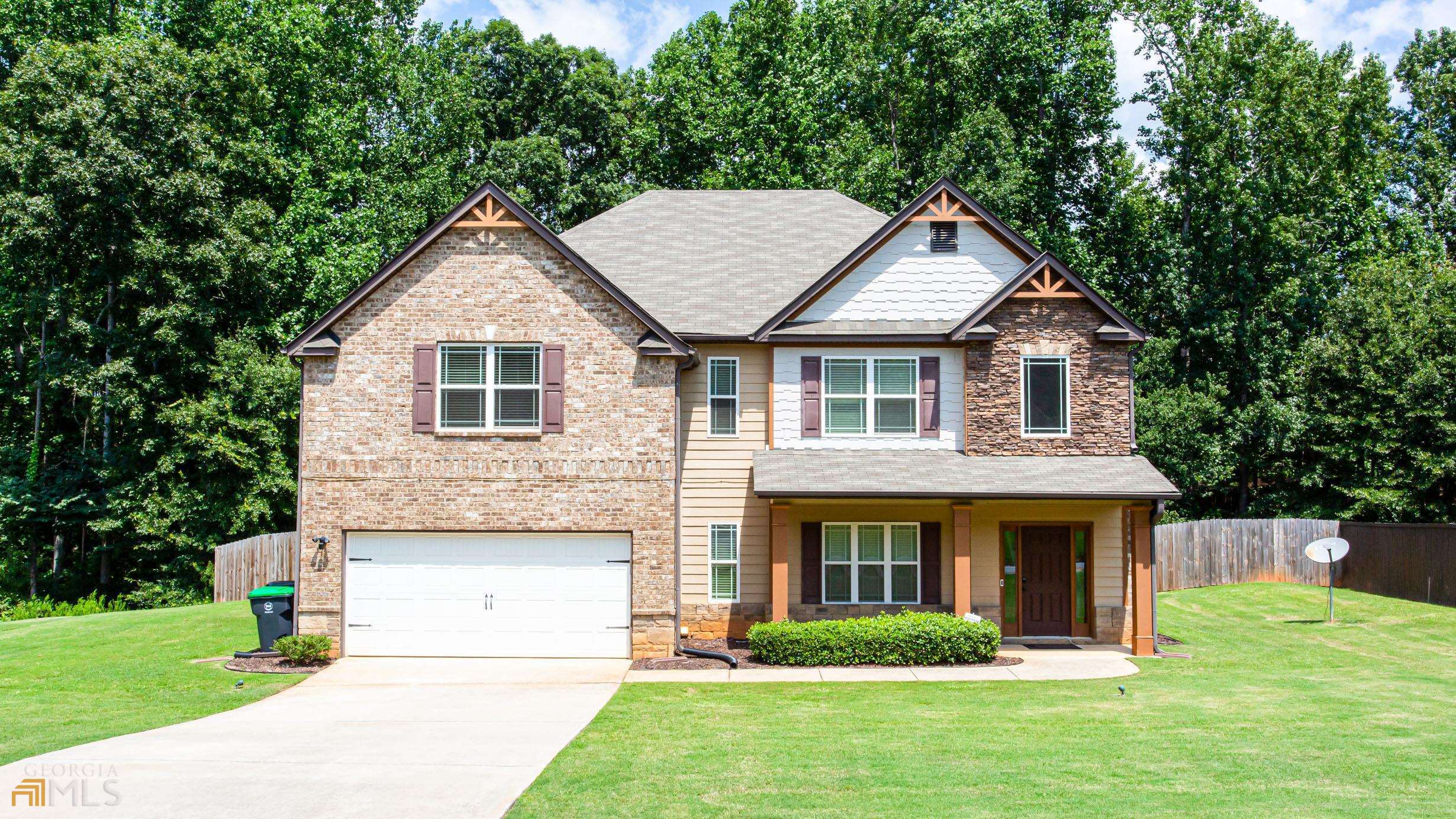 144 Tapestry Drive McDonough, GA 30252 - Photo 1 of 1 a front view of a house with garden