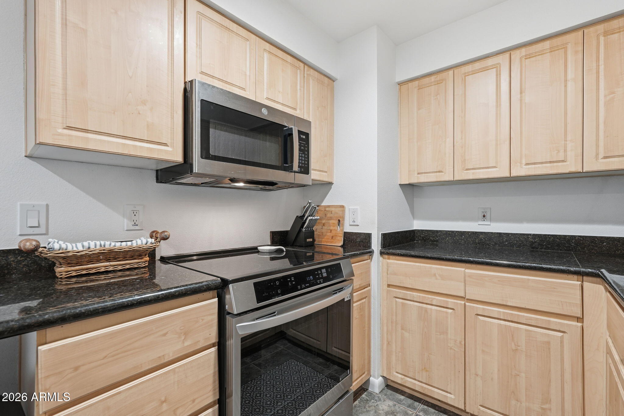1005 East 8th Street, Unit 2003 Tempe, AZ 85281 - Photo 12 of 38 a kitchen with stainless steel appliances granite countertop white cabinets and a stove a oven with white countertops