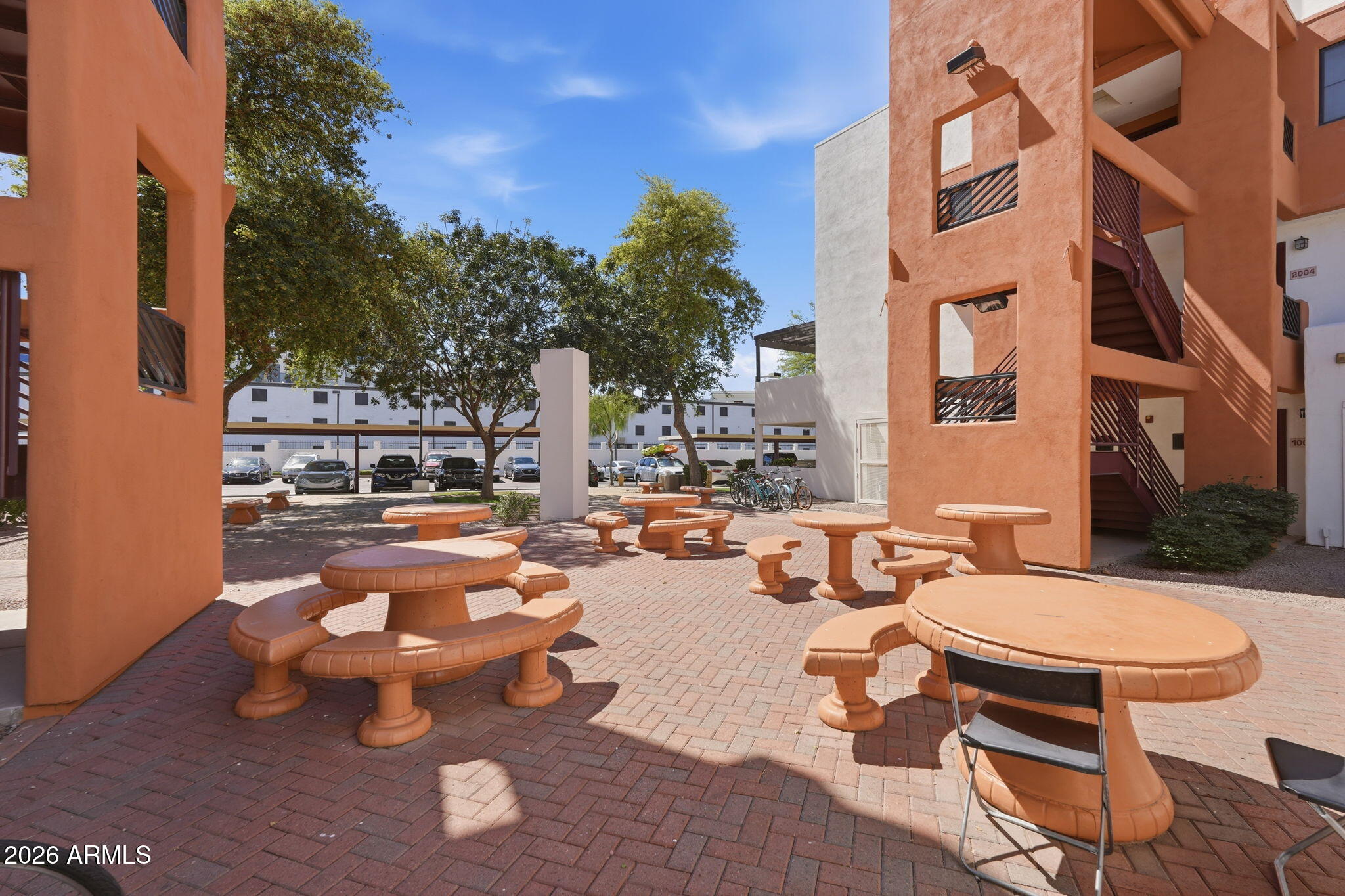 1005 East 8th Street, Unit 2003 Tempe, AZ 85281 - Photo 15 of 38 a swimming pool with outdoor seating