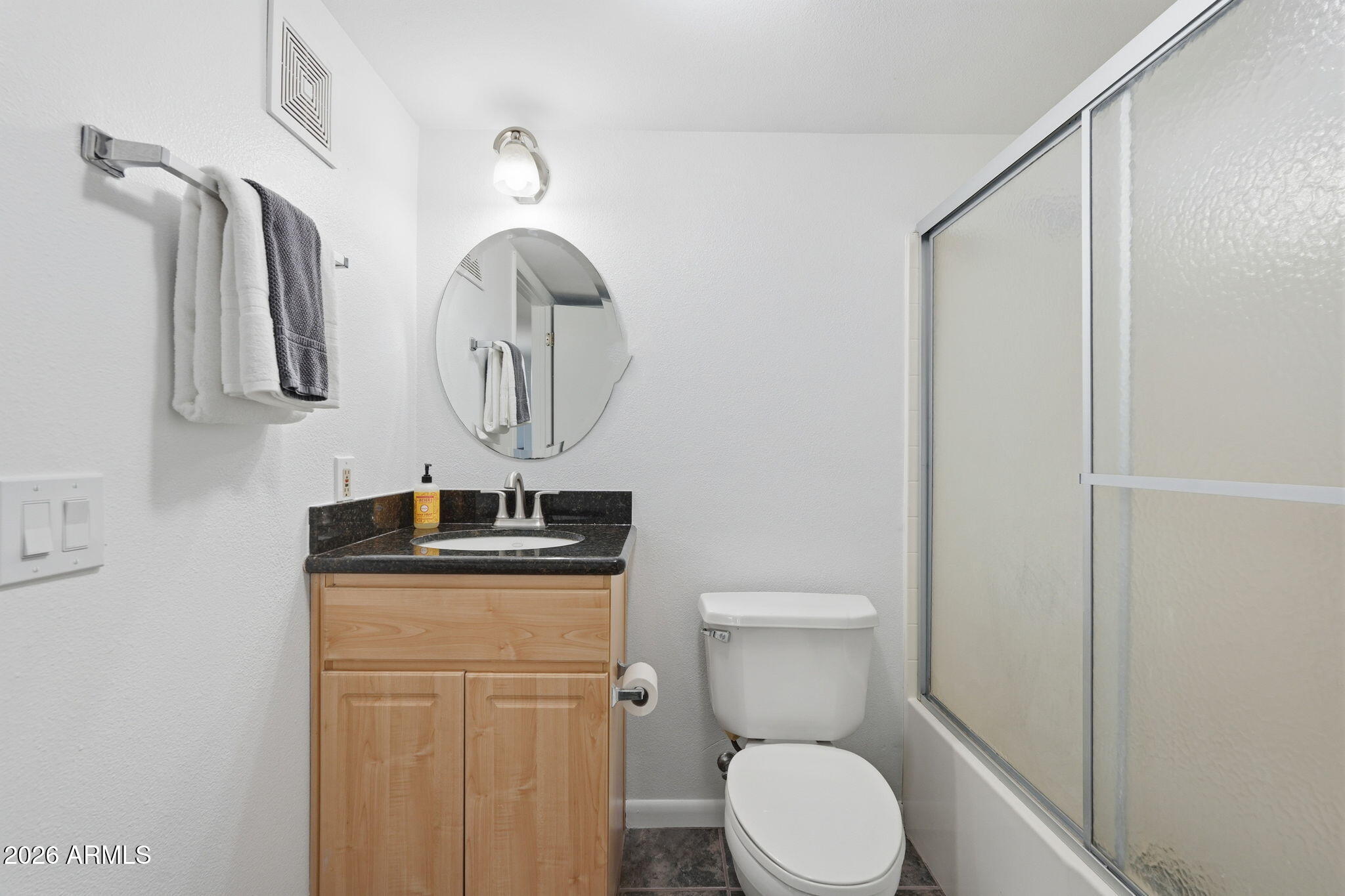 1005 East 8th Street, Unit 2003 Tempe, AZ 85281 - Photo 29 of 38 a bathroom with a toilet a sink and mirror