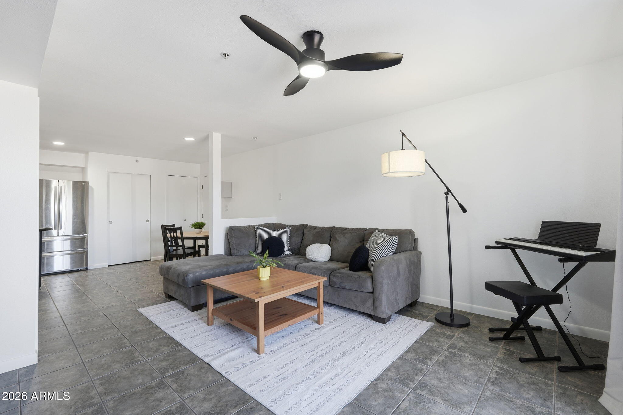 1005 East 8th Street, Unit 2003 Tempe, AZ 85281 - Photo 5 of 38 a living room with furniture and a ceiling fan