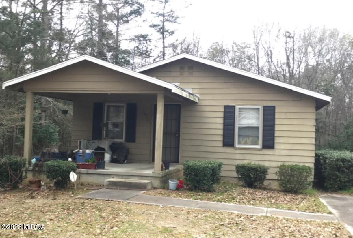 4605 Wilson Road Macon, GA 31206 - Photo 1 of 1 a front view of a house with garden