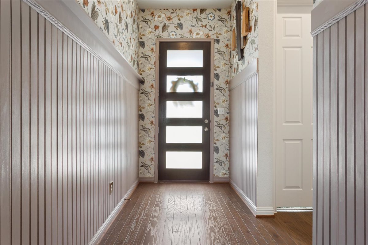 424 Millard Street Georgetown, TX 78628 - Photo 6 of 37 Entry way with custom wallpaper and panel details